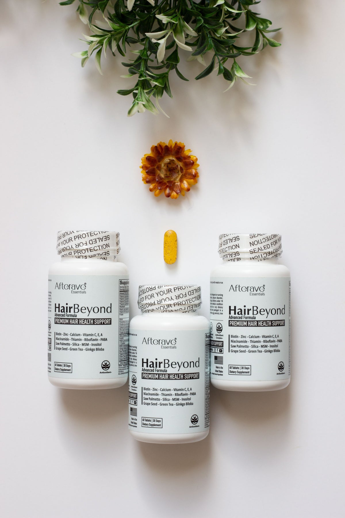Wellness supplement bottles flat lay