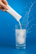 Electrolyte hydration powder being poured into water